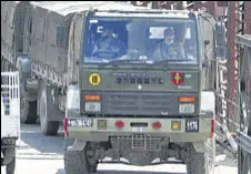  ?? ANI ?? Army vehicles depart with military contingent­s for troops posted in Ladakh on the Manali-leh route, in Kullu on Monday.