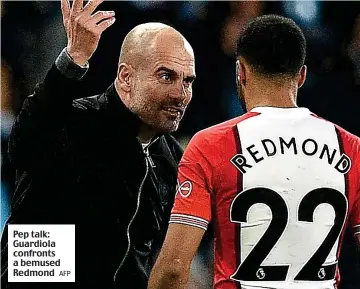  ?? AFP ?? Pep talk: Guardiola confronts a bemused Redmond