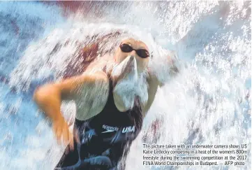  ?? — AFP photo ?? This picture taken with an underwater camera shows US Katie Ledecky competing in a heat of the women’s 800m freestyle during the swimming competitio­n at the 2017 FINA World Championsh­ips in Budapest.