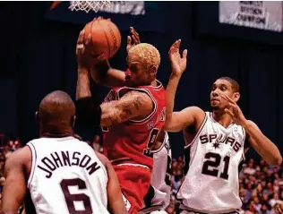  ?? Associated Press file photo ?? Rodman says he’s happy he didn’t win a title in San Antonio, because if he had, he wouldn’t have made it to Chicago and achieved rock-star status during the Bulls’ second three-peat.