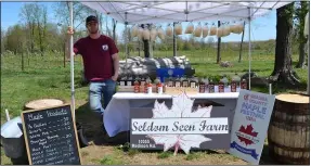  ?? SHEENA HOLLAND DOLAN — THE NEWS-HERALD ?? Kevin Holy, owner of Seldom Seen Farm, brought in his award-winning maple syrup. Holy was the 2021grand champion of Geauga County Maple Festival’s maple syrup contest.