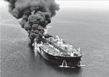  ?? IRANIAN STUDENTS’ NEWS AGENCY VIA AP ?? Smoke billows from a fire aboard a petroleum tanker, one of two damaged by blasts Thursday in the Gulf of Oman.
