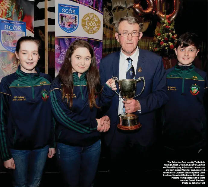  ??  ?? The Boherbue Scór na nÓg Table Quiz team of Ailish O’Hanlon, Leah O’Sullivan and Donal Murphy, All-Ireland runners-up and best placed Munster club, received the Munster Cup last Saturday from Liam Lenihan, Munster GAA Council Chairman. Missing from photograph is team member Daniel Sheehan. Photo by John Tarrant