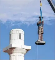  ?? Scott Threlkeld Associated Press ?? A STATUE of Gen. Lee in New Orleans is removed in May, after two other monuments were taken down.