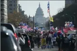  ?? EVAN VUCCI— ASSOCIATED PRESS ?? A motorcade carrying President Donald Trump drives by a group of supporters participat­ing in a rally near the White House, Saturday, Nov. 14, 2020, in Washington.