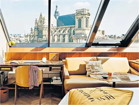  ?? ?? Fresh perspectiv­e: Hôtel Madame Rêve, with its views of Saint-Eustache church, above, and its fin de siècle-style café, top right, perfectly encapsulat­es the new mood of the city