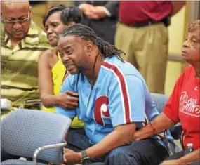  ?? PETE BANNAN — DIGITAL FIRST MEDIA ?? Rodney and Michelle Roberson, parents of 18-year-old murder victim Bianca Nikol Roberson, react to the announceme­nt of the arrest of David Desper during a press conference Sunday at the West Goshen Police Department.