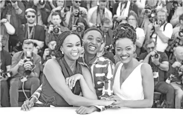  ?? — AFP file photo ?? (From Left) Kenyan director Wanuri Kahiu, Kenyan actress Samantha Mugatsia and Kenyan actress Sheila Munyiva pose during a photocall for the film 'Rafiki' during the 71st edition of the Cannes Film Festival in Cannes, southern France.