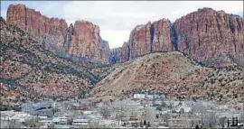  ?? Rick Bowmer Associated Press ?? A FORMER MEMBER of Warren Jeffs’ polygamist church described intimidati­on against nonbelieve­rs in Colorado City, Ariz., foreground, and Hildale, Utah.