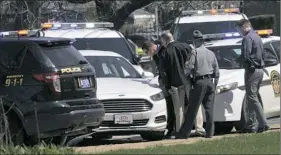  ?? Greg Wohlford/Erie Times-News ?? Pennsylvan­ia State Police look over a car as they investigat­e the scene where Steve Stephens, the suspect in the random killing of a Cleveland retiree posted on Facebook, was found shot dead Tuesday in Erie.