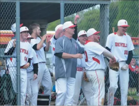  ??  ?? The VVS dugout celebrates during their comeback in the bottom of the sixth during Class B quarterfin­al action against Adirondack.