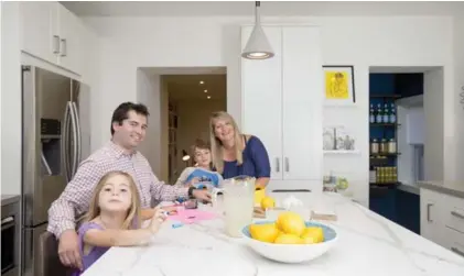  ?? CARLOS OSORIO/TORONTO STAR ?? NOW: “(The kitchen has) become this real central hub,” says Tessa Steenstra — with husband Andy Saavedra and kids Mattias and Emme.