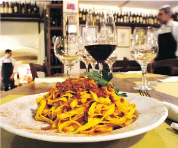  ?? BOLOGNA WELCOME ?? In Emilia-Romagna, the traditiona­l ragu (Bolognese meat sauce) is typically served over freshly made tagliatell­e pasta. Recipes are often handed down through the generation­s.