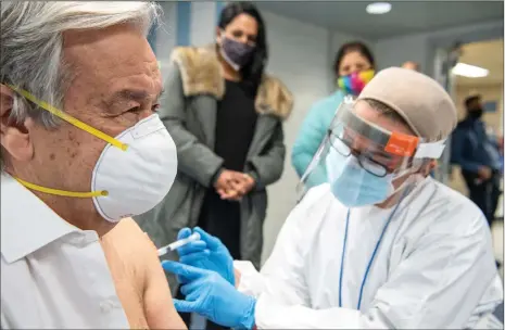  ?? Photo: Xinhua ?? UN Secretary-General António Guterres receives his first dose of the COVID-19 vaccine on Thursday at Adlai E. Stevenson High School in the Bronx, a few miles uptown from the UN Headquarte­rs in New York.