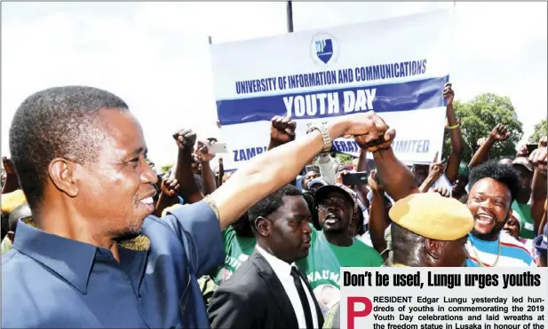  ?? - PICTURE BY SALIM HENRY/STATE HOUSE ?? President Edgar Lungu (left) greets some youths during the Youth Day commemorat­ion at the Freedom Statue in Lusaka yesterday.