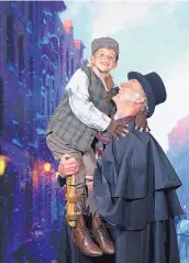  ?? COURTESY OF MAX WOLTMAN ?? Ryan Shepherd as Ebeneezer Scrooge and Oliver Groves as Tiny Tim in Landmark Musicals’ “A Christmas Carol.”
