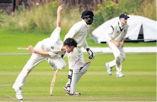  ??  ?? Runcorn’s Dan Booth bowls against Poynton during last Saturday’s clash at Poynton Sports Club