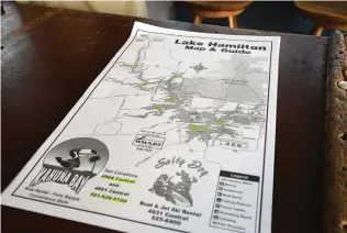  ?? The Sentinel-Record/Lance Brownfield ?? ■ This map of shallow points in Lake Hamilton is provided by Kahuna Bay Boat Rental and Marina to its customers, along with a printout of Arkansas state boating laws.