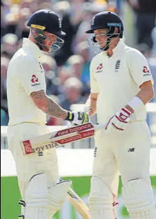  ?? REUTERS ?? England captain Joe Root (right) and allrounder Ben Stokes hit fifties to lead England’s fightback in Old Trafford.