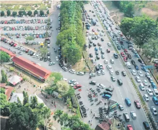  ?? It is backed by a ?? Kenanga Research reckons that the automotive industry earnings visibility is booking backlog of 200,000 units at the end of February. — Bernama photo still good as