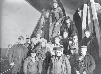  ??  ?? Proud boat builders pose for a shot, date unknown.