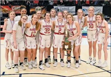  ?? Staff photo/John Zwez ?? Members of the New Knoxville girls basketball team pose with the trophy for finishing as the Division IV state runner-up following Saturday’s game with Waterford at the University of Dayton.