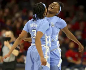  ?? Rebecca Sasnett, Arizona Daily Star ?? North Carolina’s Kennedy Todd-williams (3) and Anya Poole celebrate Monday in Tucson, Ariz.