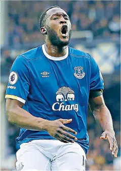  ??  ?? In the clear: Romelu Lukaku roars his delight after scoring Everton’s third goal