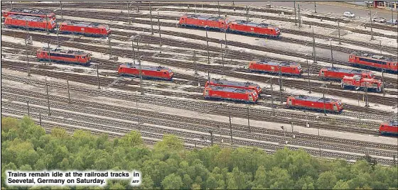  ?? AFP ?? Trains remain idle at the railroad tracks in Seevetal, Germany on Saturday.