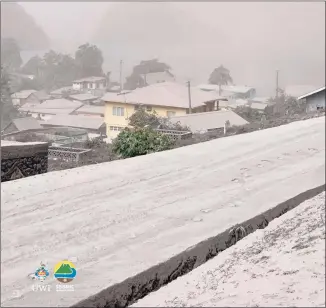  ?? UWI Seismic Research Centre / AFP via Getty Images ?? Homes in Chateaubel­air, St. Vincent, are covered in ash after Friday’s eruption of the La Soufriere volcano.