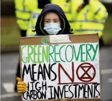  ??  ?? A protester outside the Ineos plant in Grangemeou­th