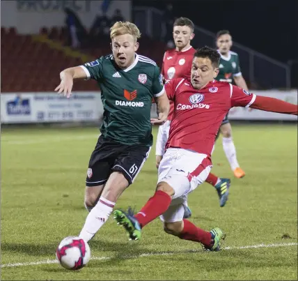  ??  ?? Eduardo Pinceli tries to dispossess Nicky Low. Pics: Donal Hackett.