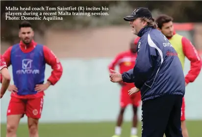  ??  ?? Malta head coach Tom Saintfiet (R) incites his players during a recent Malta training session. Photo: Domenic Aquilina