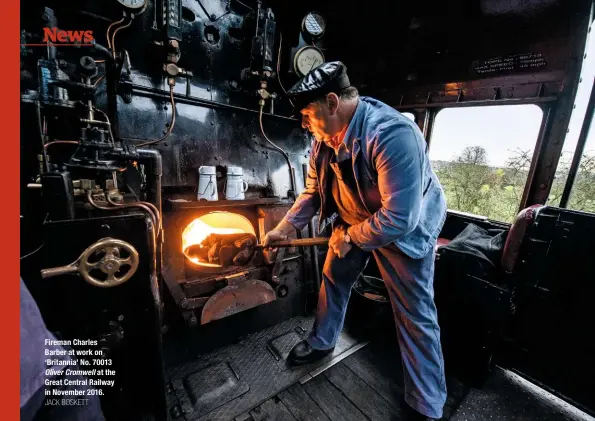  ?? JACK BOSKETT ?? Fireman Charles Barber at work on ‘Britannia’ No. 70013 Oliver Cromwell at the Great Central Railway in November 2016.