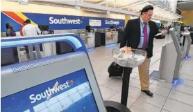  ?? AMY DAVIS/BALTIMORE SUN ?? Today marks 25 years that Southwest Airlines has flown from Baltimore-Washington Internatio­nal Thurgood Marshall Airport. The airline and airport have both benefited.