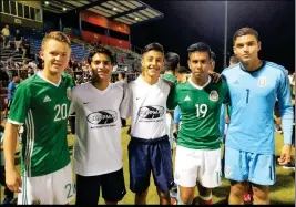  ??  ?? TADEO MONTEJANO (SECOND FROM LEFT) AND IAN TOPETE (third from left) pose with other players from around Arizona who competed against all star youth soccer players from Mexico in a game in Tucson.