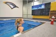  ?? ?? Lesley Boyd Green, a member of UTC’s cross country and track and field programs, uses a treadmill in a pool for rehabilita­tion at the sports medicine area in the Wolford Family Athletics Complex on Friday.