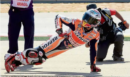  ?? AFP ?? Fun time: Marc Marquez celebrates after winning the MotoGP race of the Aragon Grand Prix at the Motorland Racetrack in Alcaniz yesterday. —