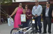  ?? JULIO MORALES ?? Mains Elementary School second-grader Sergio Almanza was presented with a new bicycle and a certificat­e from Assemblyma­n Eduardo Garcia’s office for being his grade level’s top reader.