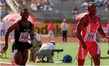  ??  ?? Gus Nketia, Edward’s father, competes against British Olympic champion Linford Christie, right, in the 100m at the Commonweal­th Games in Victoria, Canada, in 1994.