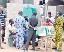  ?? Photo: Benedict Uwalaka ?? Electorate trying cast their votes at Polling Unit 083, ward 10, Sunday Omotosho, Agbado Oke-Odo, Alimosho in Lagos, yesterday