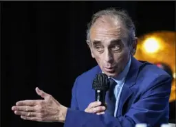  ?? Michel Euler/Associated Press ?? Hard-right political talk-show star Eric Zemmour gestures as he talks during a meeting to promote his latest book “La France n’a pas dit son dernier mot” (France has not yet said its last word) in Versailles, west of Paris, on Oct. 19.