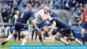  ??  ?? ROME: Italy’s Sergio Parisse vies with Scotland’s Tim Swinson during the Six Nations internatio­nal rugby union match between Italy and Scotland at the Olympic Stadium in Rome, yesterday. — AFP