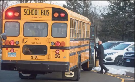  ?? H John Voorhees III / Hearst Connecticu­t Media file photo ?? Stadley Rough Elementary School Principal Lenny Cerlich welcomes students and their bus driver back to school last January.