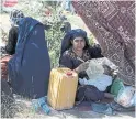  ?? RAHMAT GUL THE ASSOCIATED PRESS ?? Afghan women in a public park in Kabul. The rebel commanders the U.S. has traditiona­lly backed are not ideologica­lly different from the Taliban when it came to women, Shree Paradkar writes.