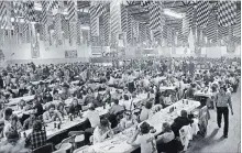  ?? WATERLOO REGION RECORD FILE PHOTO ?? Jubilant Oktoberfes­ters fill the former Kitchener Memorial Auditorium annex in this photo from 1975.