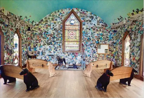  ?? MELANIE D.G. KAPLAN PHOTOS/FOR THE WASHINGTON POST ?? Stephen Huneck’s Dog Chapel, which opened in 2000 at Dog Mountain, was designed as a sacred space where humans could sit, contemplat­e, grieve and celebrate our furry best friends.