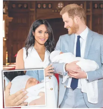  ?? Pictures: AFP ?? Proud as punch parents Harry and Meghan show off their newborn son at St George’s Hall at Windsor Castle last night. They are yet to reveal his name.