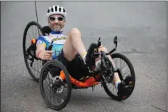  ?? TIM TAI/PHILADELPH­IA INQUIRER ?? Kyle Bryant poses for a portrait on the trail behind his home in Exton, Pa., on April 19. Bryant, who has Friedreich’s ataxia, a neurodegen­erative movement disorder, wrote a book called “Shifting Into High Gear.”