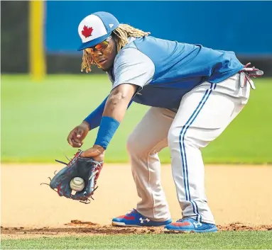  ?? NATHAN DENETTE THE CANADIAN PRESS ?? Top Blue Jays prospect Vladimir Guerrero Jr. is earning rave reviews for his humility at spring training.